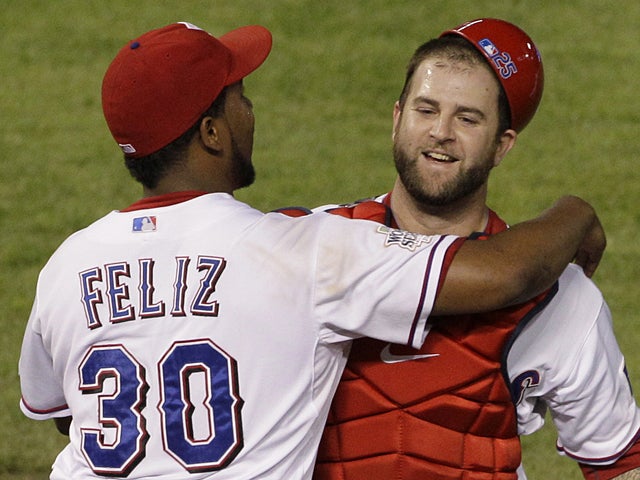 Neftali Feliz and Mike Napoli celebrate  