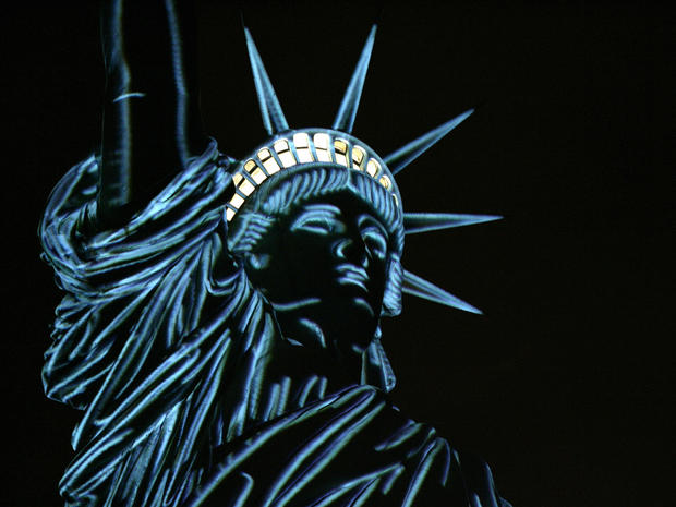 The Statue of Liberty is lit to show the contours of the sculpture during a special show by French Champagne maker Moet & Chandon Sept. 28, 2006, in New York, one month before the 120th anniversary of the statue's dedication. The usual floodlights were re 