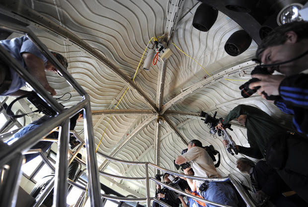 Members of the press take turns filming out the windows of the crown of the Statue of Liberty during a media tour May 20, 2009. On July 4, 2009, the statue's crown was reopened to visitors for the first time since the Sept. 11, 2001, attacks on the World  