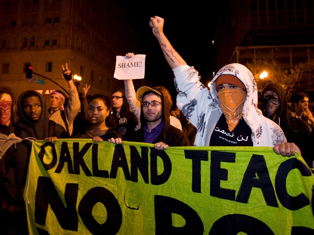 Occupy Wall Street protesters yell towards police
