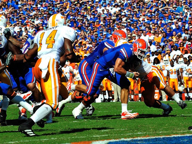 Tim Tebow  runs for a touchdown 