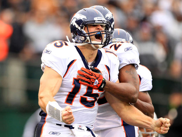 Tim Tebow celebrates after he ran in for a touchdown  