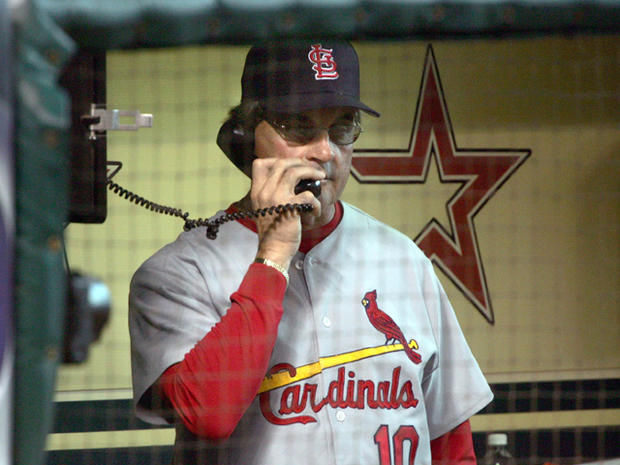 Tony La Russa makes a call to his bullpen  