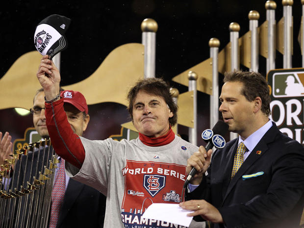 Tony La Russa celebrates with the World Series trophy 