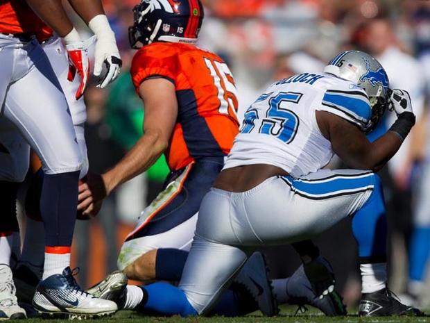 DENVER, CO - OCTOBER 30: Linebacker Stephen Tulloch #55 of the Detroit Lions reacts by 'Tebowing' after making a sack on quarterback Tim Tebow #15 of the Denver Broncos during the first quarter at Sports Authority Field at Mile High on October 30, 2011 in Denver, Colorado. (Photo by Justin Edmonds/Getty Images) 