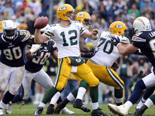 Aaron Rodgers throws in the pocket 