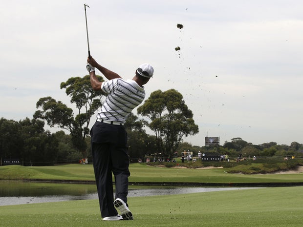 Tiger Woods plays a shot 