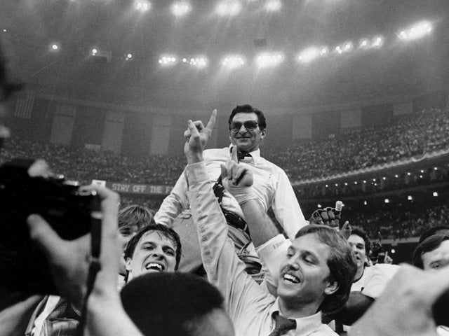 Joe Paterno takes a victory ride from his players 