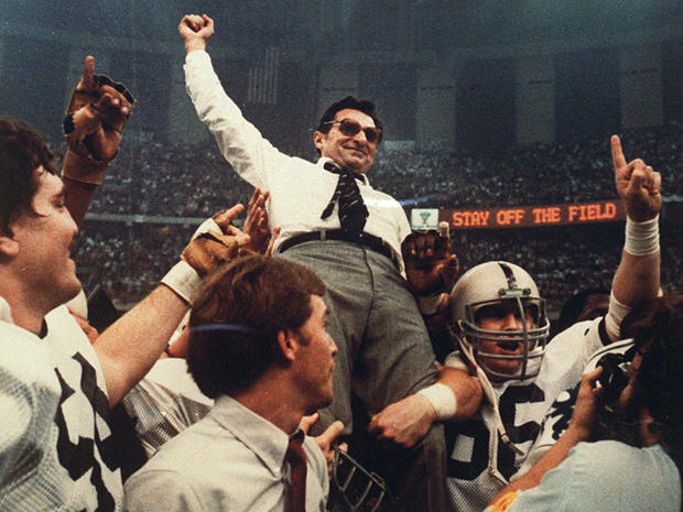 Joe Paterno celebrates as he is carried off the field  