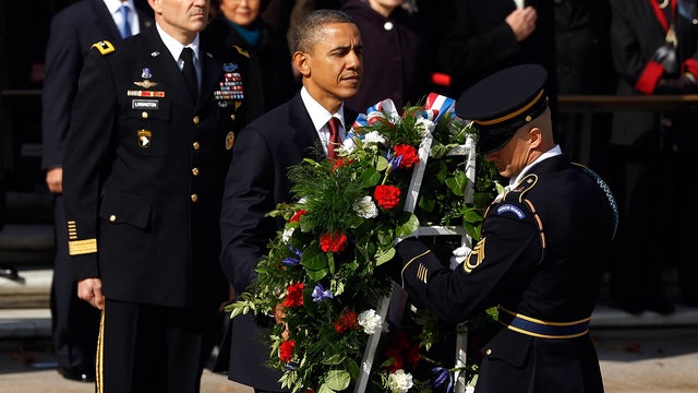 President Obama is assisted by Sgt. 1st Class Chad Eric Wayne Stackpole in placing a wreath at the Tomb of the Unknowns during a Veterans Day full honor ceremony at Arlington National Cemetery Nov. 11, 2011, in Arlington, Va. 