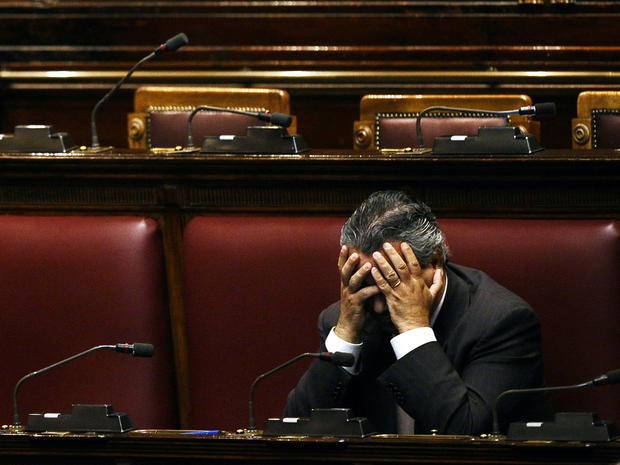 An unidentified deputy sits in an empty Italian Lower House before a debate to approve the last package of economic reforms in Rome Nov. 12, 2011. 