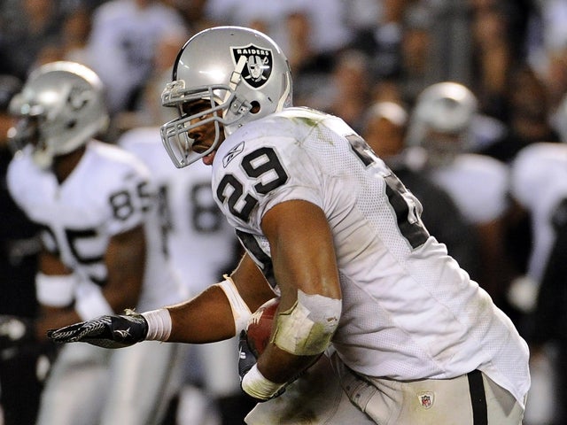Michael Bush carries the ball  