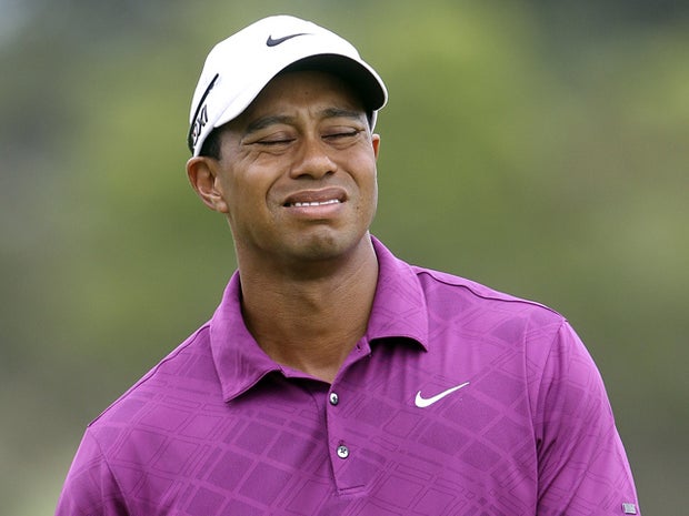 Tiger Woods reacts to a put on the 3rd green 