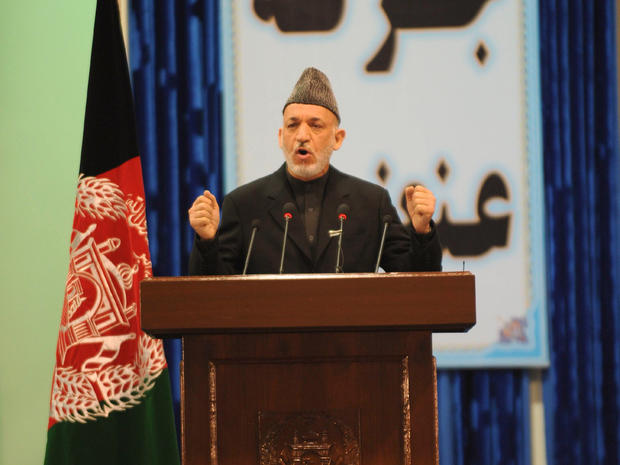 Afghan President Hamid Karzai addresses a loya jirga 