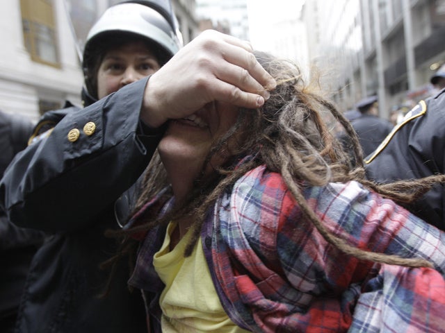 Police officers arrest a demonstrator affiliated with the Occupy Wall Street movement Nov. 17, 2011, in New York. Hundreds of Occupy demonstrators marched through New York's financial district and staged sit-ins in the streets near the New York Stock Exch 