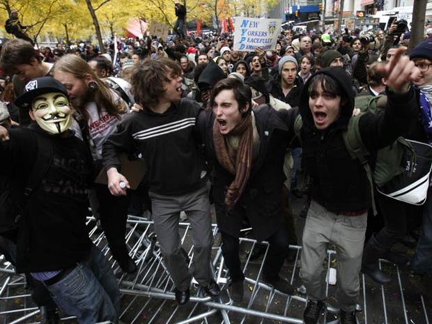 Occupy Wall Street protesters chant while jumping on police barricades in Zuccotti Park in New York Nov. 17, 2011. Demonstrations of Occupy Wall Street protesters popped up from coast to coast to mark two months since the movement's birth in Zuccotti Park 