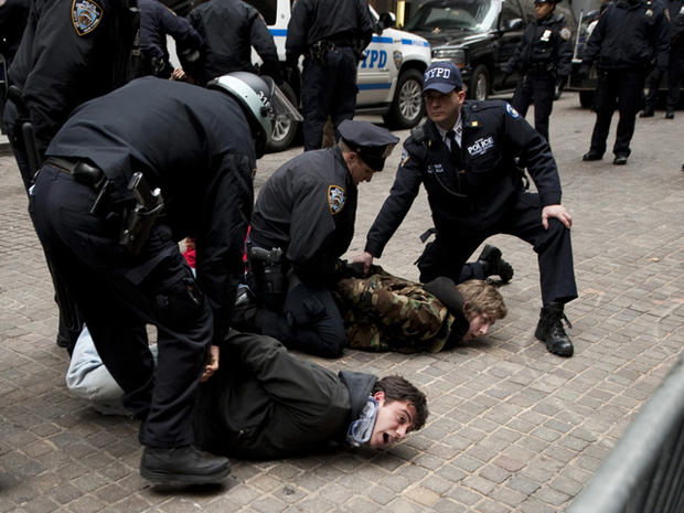 Occupy Wall Street protesters are arrested by police after blocking access to the New York Stock Exchange area Nov. 17, 2011, in New York. 
