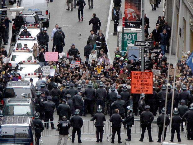 New York City police officers prevent protesters from entering Wall Street Nov. 17, 2011. Two days after the encampment that sparked the global Occupy protest movement was cleared by authorities, demonstrators marched through New York's financial district 
