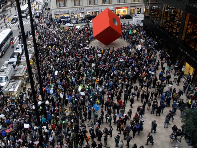 Demonstrators affiliated with the Occupy Wall Street movement assemble across the street from Zuccotti Park in lower Manhattan before marching through the streets of New York's financial district Nov. 17, 2011. 
