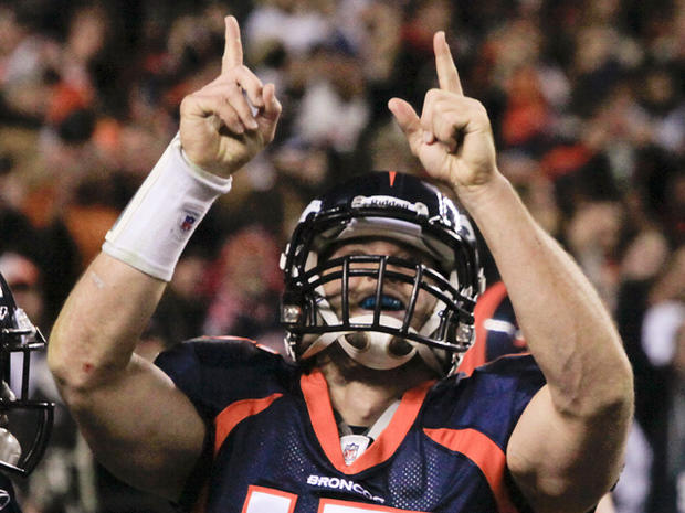 Tim Tebow reacts after scoring a touchdown 