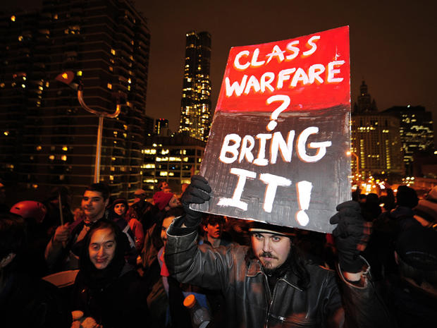 Occupy Wall Street supporters march across the Brooklyn Bridge during a protest march in New York Nov. 17, 2011. 