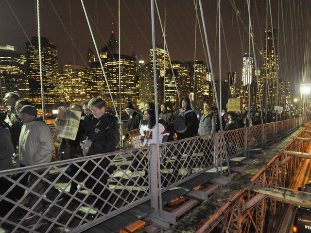 Occupy Wall Street protesters walk across the Brooklyn Bridge after a rally in Foley Square Nov. 17, 2011, in New York. 