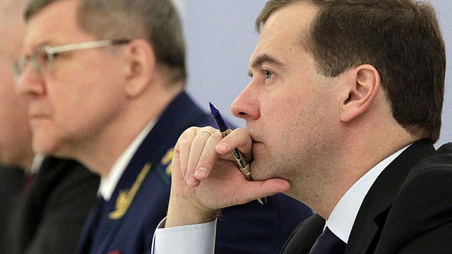 Russian President Dmitry Medvedev, right, listens at the Gorki residence outside Moscow, on Wednesday, Nov. 23, 2011, during a meeting with prosecutors 