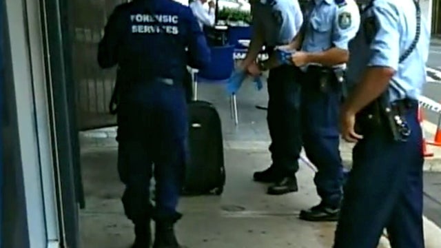 Police surround cash-laden suitcase 