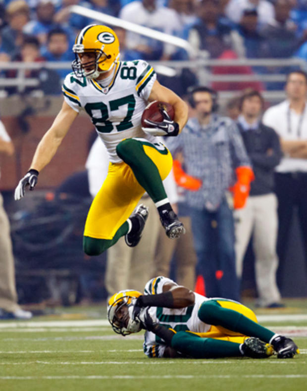 Jordy Nelson leaps over wide receiver Donald Driver  