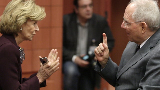 Spain's Finance Minister Elena Salgado speaks with German Finance Minister Wolfgang Schaeuble 