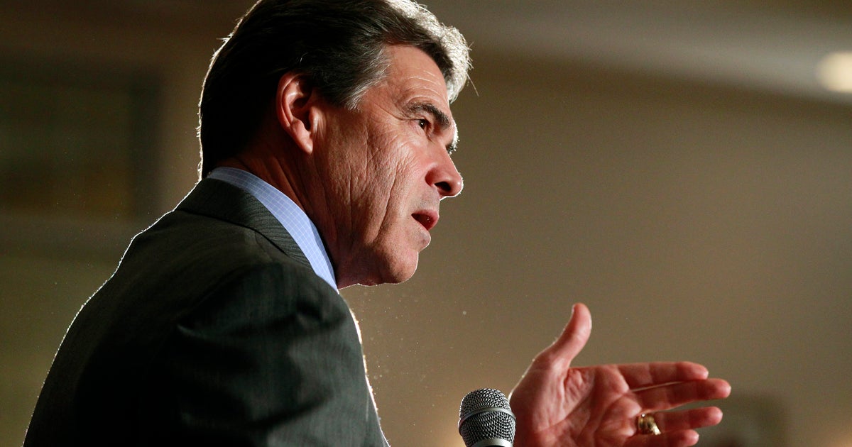 Perry and allies blanketing Iowa with TV ads - CBS News