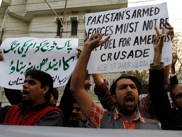 Pakistani protesters rally to condemn a NATO airstrike on Pakistani troops 