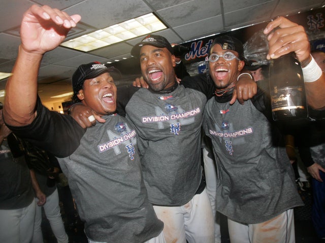 Anderson Hernandez , Carlos Delgado  and Jose Reyes celebrate 