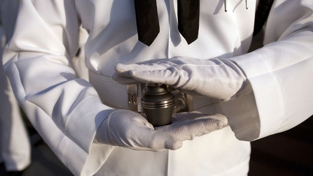 Urn with the ashes of Pearl Harbor survivor Lee Soucy, held by Navy Region Hawaii Honor Guard 