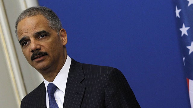 U.S. Attorney General Eric Holder speaks during a press conference in Paris, Dec. 2, 2011.  