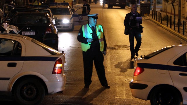 Police close the road outside Korydallos prison in western Athens Dec. 12, 2011. Inmates at Greece's largest jail have taken at least one prison guard hostage, police and justice ministry officials said. 