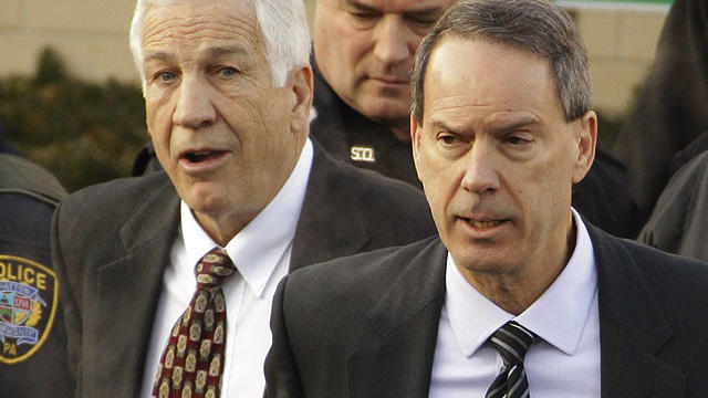 Former Penn State University assistant football coach Jerry Sandusky, left, walks with his attorney Joe Amendola, right, as he leaves the Centre County Courthouse after waiving a preliminary hearing Tuesday, Dec. 13, 2011 in Bellefonte, Pa.  