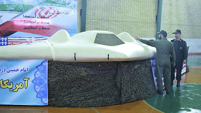 This photo released on Thursday, Dec. 8, 2011, by the Iranian Revolutionary Guards, claims to show US RQ-170 Sentinel drone which Tehran says its forces downed earlier this week, as the chief of the aerospace division of Iran's Revolutionary Guards, Gen.  