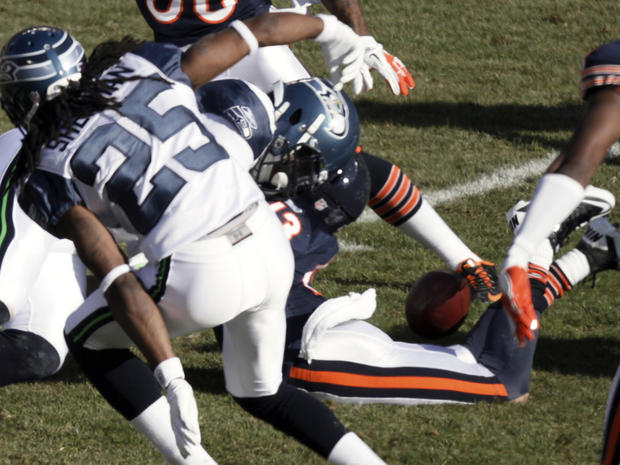 Johnny Knox lies on the ground after being hit 