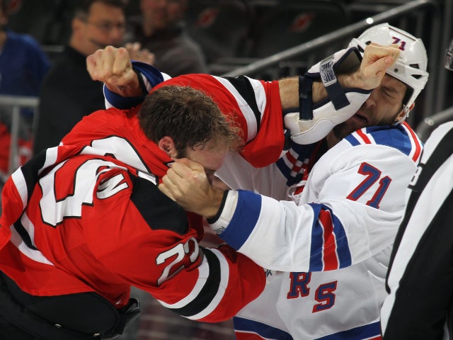 Cam Janssen and Mike Rupp fight just three seconds into the first period 