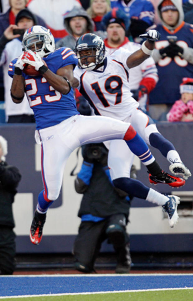 Aaron Williams intercepts a pass by Denver Broncos' Tim Tebow 