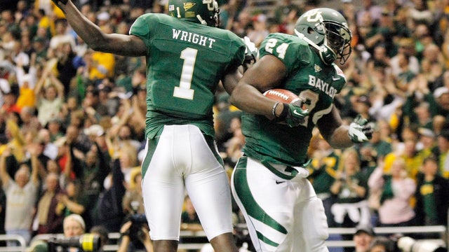 Baylor's Terrance Ganaway, right, and Kendall Wright celebrate a touchdown  