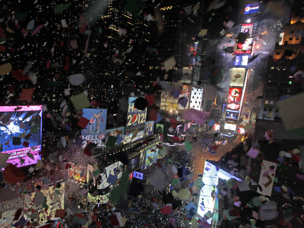 Confetti flies over New York's Times Square as the clock strikes midnight during a New Year's Eve celebration as seen from the balcony of the Marriott Marquis hotel Jan. 1, 2012. 