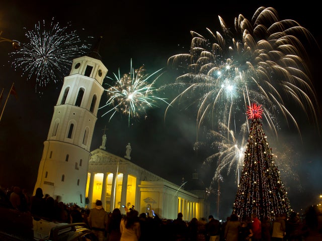 Fireworks light the sky above Cathedral Square in Vilnius, Lithuania, shortly after midnight in celebration of the New Year Jan. 1, 2012. 