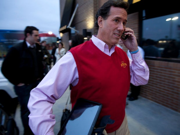 Former Pennsylvania Sen. Rick Santorum talks on the phone after a campaign stop Dec. 30, 2011, in Ames, Iowa. 