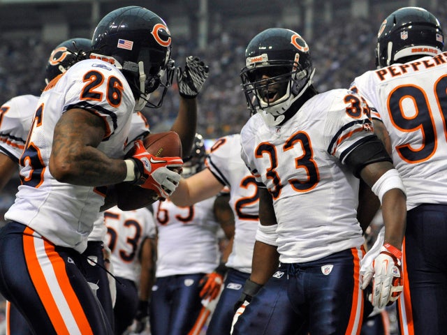 Charles Tillman celebrates his 22-yard interception return  