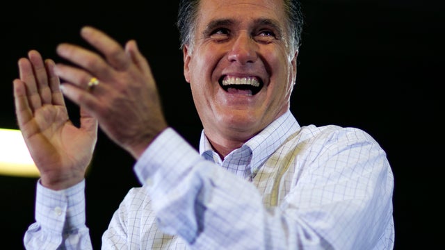 Former Massachusetts Gov. Mitt Romney smiles during a campaign stop Jan. 2, 2012, in Marion, Iowa. 