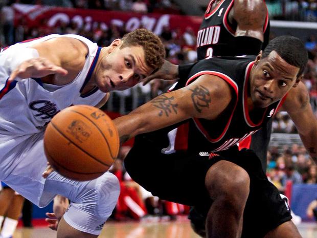 Marcus Camby and Blake Griffin reach for a loose ball  