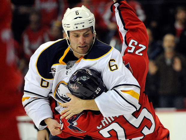 Mike Weber and Jason Chimera fight during the first period 