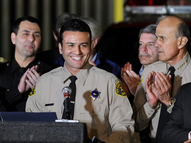 Real estate attorney and reserve Los Angeles Deputy Sheriff Shervin Lalezary is applauded 